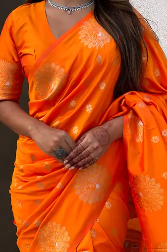 Orange soft silk blend dual zari woven saree with peacock border