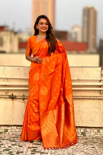 Orange soft silk blend dual zari woven saree with peacock border