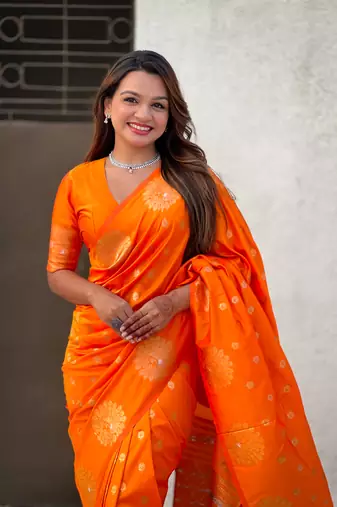 Orange soft silk blend dual zari woven saree with peacock border