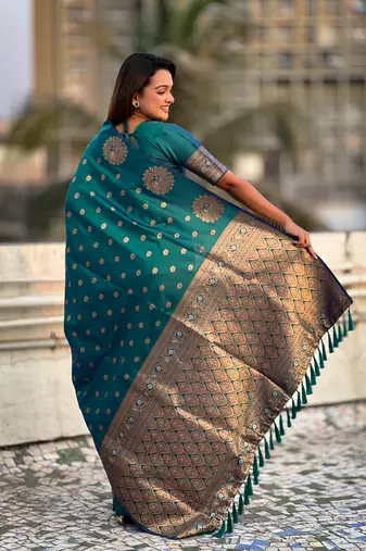 Green soft silk blend dual zari woven saree with peacock border