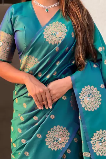 Green soft silk blend dual zari woven saree with peacock border