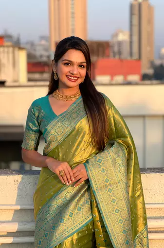 Green pure tissue zari woven saree with contrast weaves