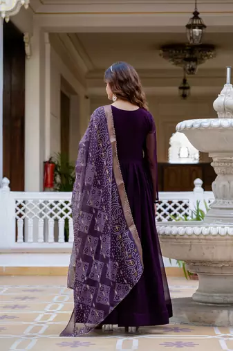 Wine faux georgette pearl hand work flared gown with heavy dupatta