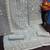 Grey embroidary and coding work heavy butterfly net with japan satin semistitched salwar suit