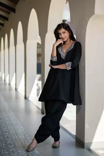 Black short kurta embroidered co-ord set.