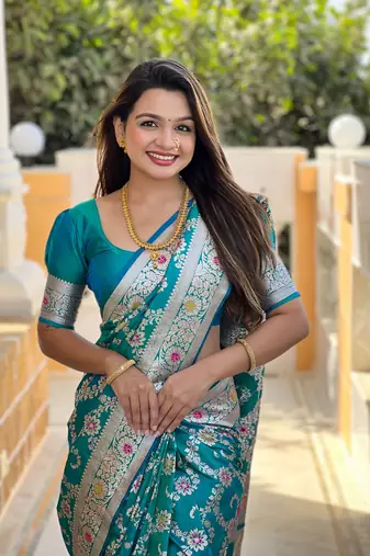 teal green weaving zari meenakari work silk blend saree