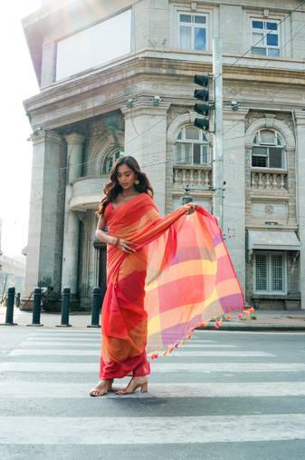 Red handwoven mul cotton saree with checks & tassels