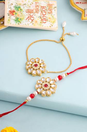 set of 2 gold toned kundan studded floral design bhaiya bhabhi rakhi set with roli chawal chandan & mishri