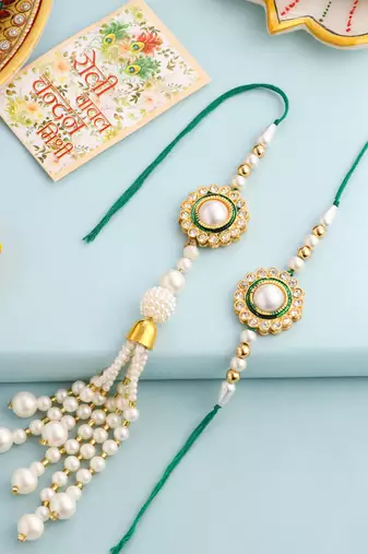 set of 2 white & green stone studded handcrafted bhaiya bhabhi thread rakhi with roli chawal chandan & mishri