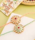 men set of 2 peach & green kundan studded round floral design rakhi with roli chawal chandan & mishri