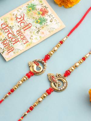   set of 2 golden red religious designer ganesh ji thread rakhi with roli chawal chandan & mishri 1
