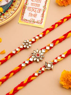   set of 3 red & yellow kundan studded floral design thread rakhi with roli chawal chandan & mishri 1