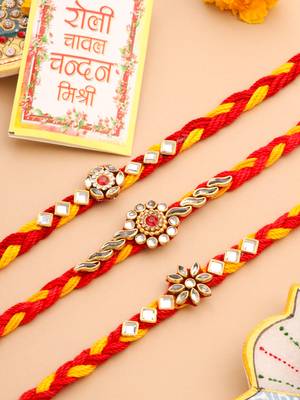   set of 3 red & yellow kundan studded floral design thread rakhi with roli chawal chandan & mishri 1