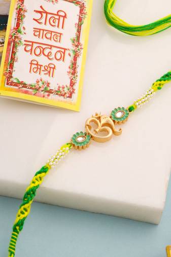 men green kundan studded om design thread rakhi with roli chawal chandan & mishri
