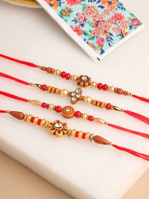   set of 4 red artificial stones & beads floral shape thread rakhi with roli chawal chandan & mishri 1