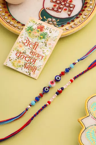   multicolor evil eye artificial beads thread rakhi with roli chawal chandan & mishri