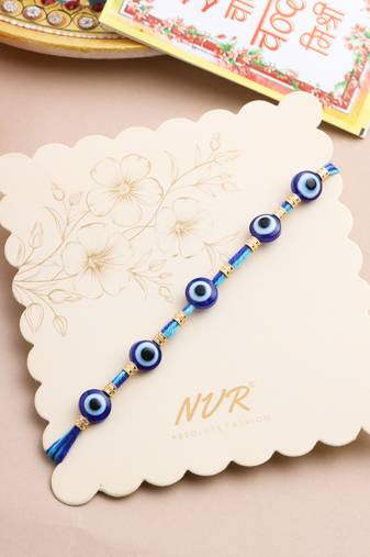 blue evil eye thread rakhi with roli chawal chandan & mishri