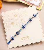 blue evil eye thread rakhi with roli chawal chandan & mishri