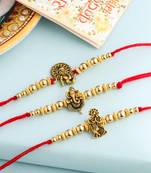   set of 3 gold toned designer ganesh ji thread rakhi with roli chawal chandan & mishri