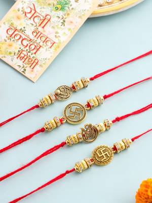   set of 4 gold toned artificial stones swastik design thread rakhi with roli chawal chandan & mishri 1