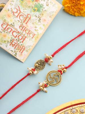   set of 2 gold toned pearls swastik desgin thread rakhi with roli chawal chandan & mishri 1