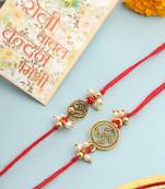   set of 2 gold toned pearls swastik desgin thread rakhi with roli chawal chandan & mishri