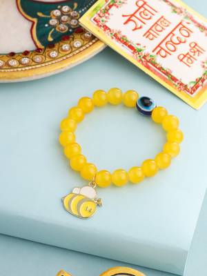 kids cartoon design yellow artificial beads thread rakhi with roli chawal chandan & mishri 1