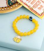 kids cartoon design yellow artificial beads thread rakhi with roli chawal chandan & mishri