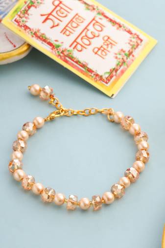 women gold toned artificial beads wraparound rakhi with roli chawal chandan & mishri