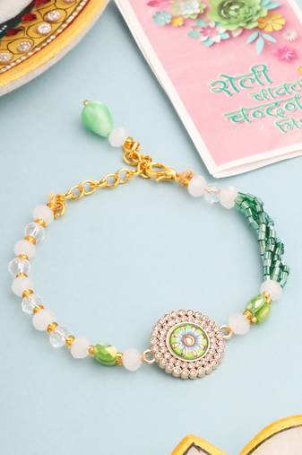   green artificial stones & beads floral wraparound rakhi with roli chawal chandan & mishri