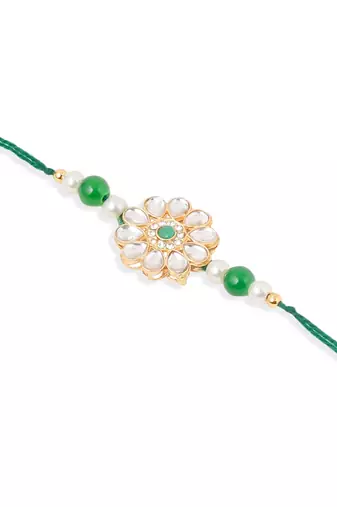 set of 2 kundan studded floral design gold toned bhaiya bhabhi rakhi set with roli chawal chandan & mishri