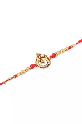   set of 2 golden red religious designer ganesh ji thread rakhi with roli chawal chandan & mishri