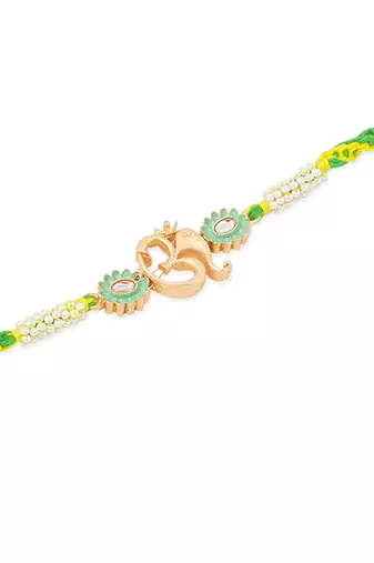 men green kundan studded om design thread rakhi with roli chawal chandan & mishri