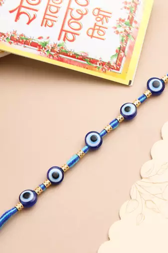 blue evil eye thread rakhi with roli chawal chandan & mishri