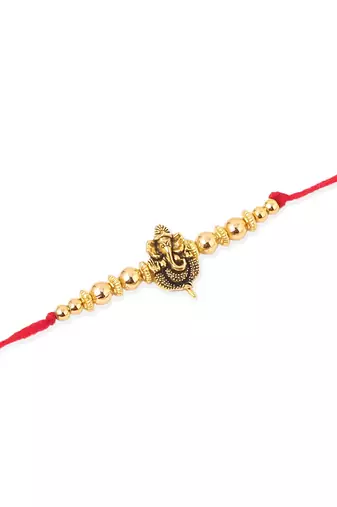   set of 3 gold toned designer ganesh ji thread rakhi with roli chawal chandan & mishri