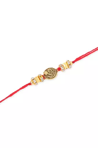   set of 4 gold toned artificial stones swastik design thread rakhi with roli chawal chandan & mishri