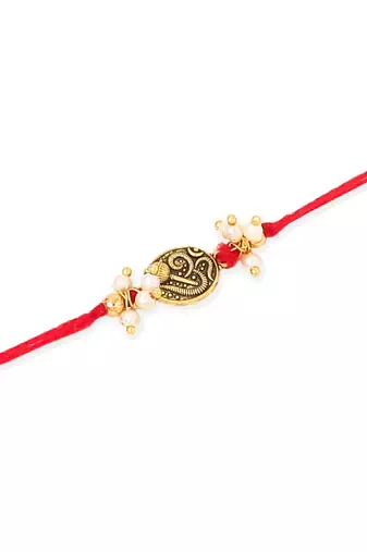   set of 2 gold toned pearls swastik desgin thread rakhi with roli chawal chandan & mishri