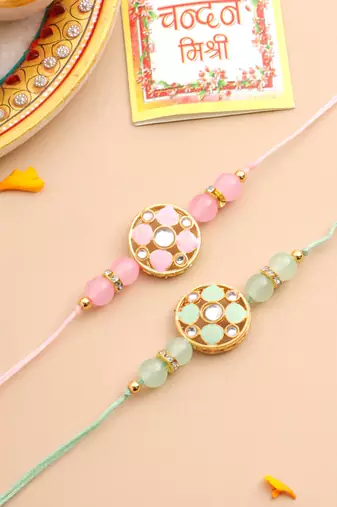   set of 2 artificial stones & beads floral design thread rakhi with roli chawal chandan & mishri