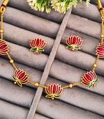 Traditional gold-plated lotus necklace and earrings set with red enamel work, indian jewellery