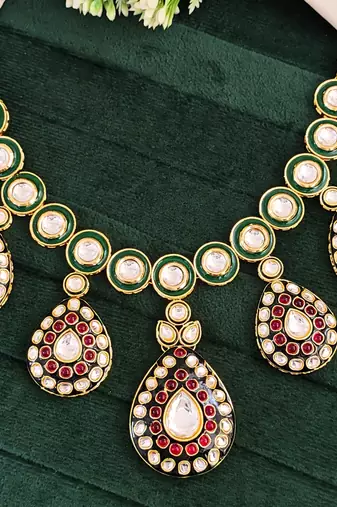 Traditional indian kundan necklace set with earrings, green enamel and ruby red stones, gold-plated