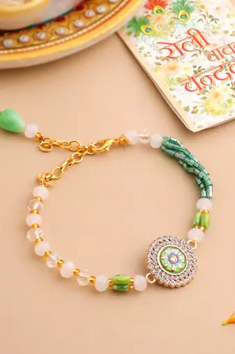   green artificial stones & beads floral wraparound rakhi with roli chawal chandan & mishri