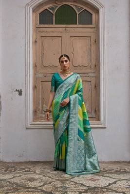 Green banarasi silk blend blend weaving saree with zari woven fancy tassels 1
