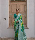 Green banarasi silk blend weaving saree with zari woven fancy tassels