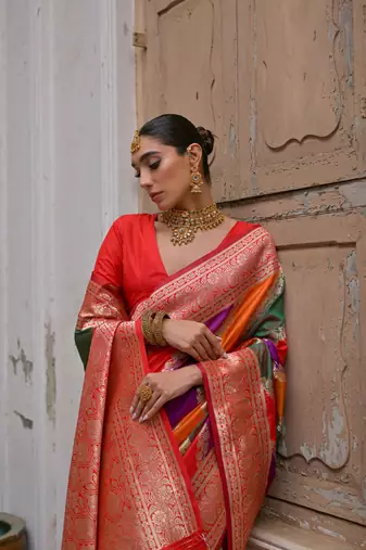 Red banarasi silk blend blend weaving saree with zari woven fancy tassels