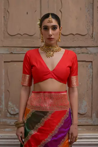 Red banarasi silk blend blend weaving saree with zari woven fancy tassels