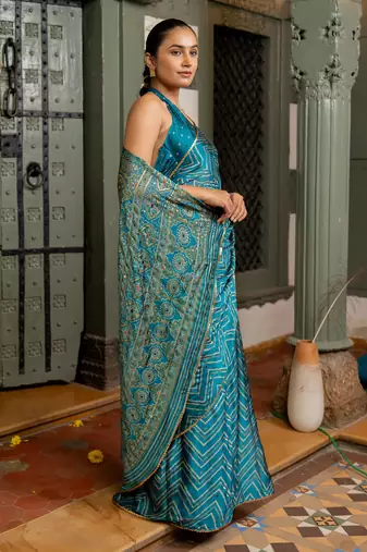 Rama blue chiffon foil chevron print ethnic motif sequins lace border saree with unstiched blouse piece