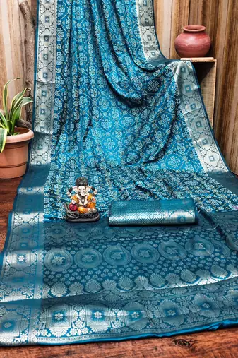 Blue soft satin silk blend bandhej print saree with kanchi zari weaving border
