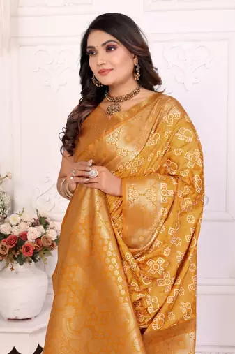 Yellow soft satin silk blend bandhej print saree with kanchi zari weaving border