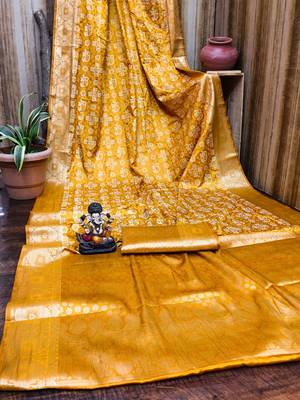 Yellow soft satin silk blend bandhej print saree with kanchi zari weaving border 4