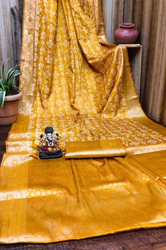 Yellow soft satin silk blend bandhej print saree with kanchi zari weaving border